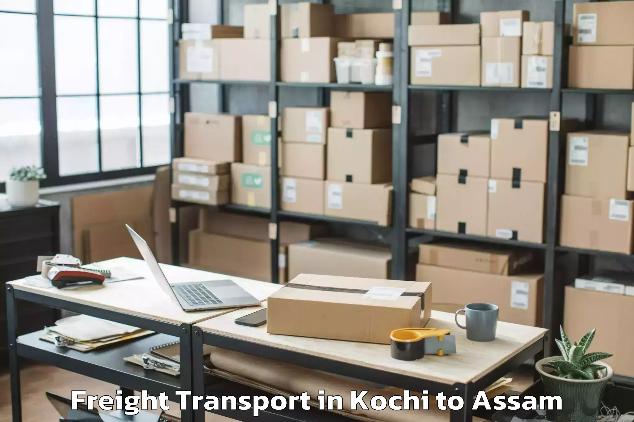 Book Kochi to Dhakuakhana Pt Freight Transport Online